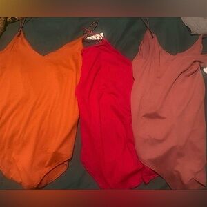 Trio of Slip Bodysuits in Orange, Red, and Mauve